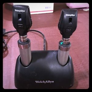 Two Welch Allyn Ophthalmoscopes with charger.